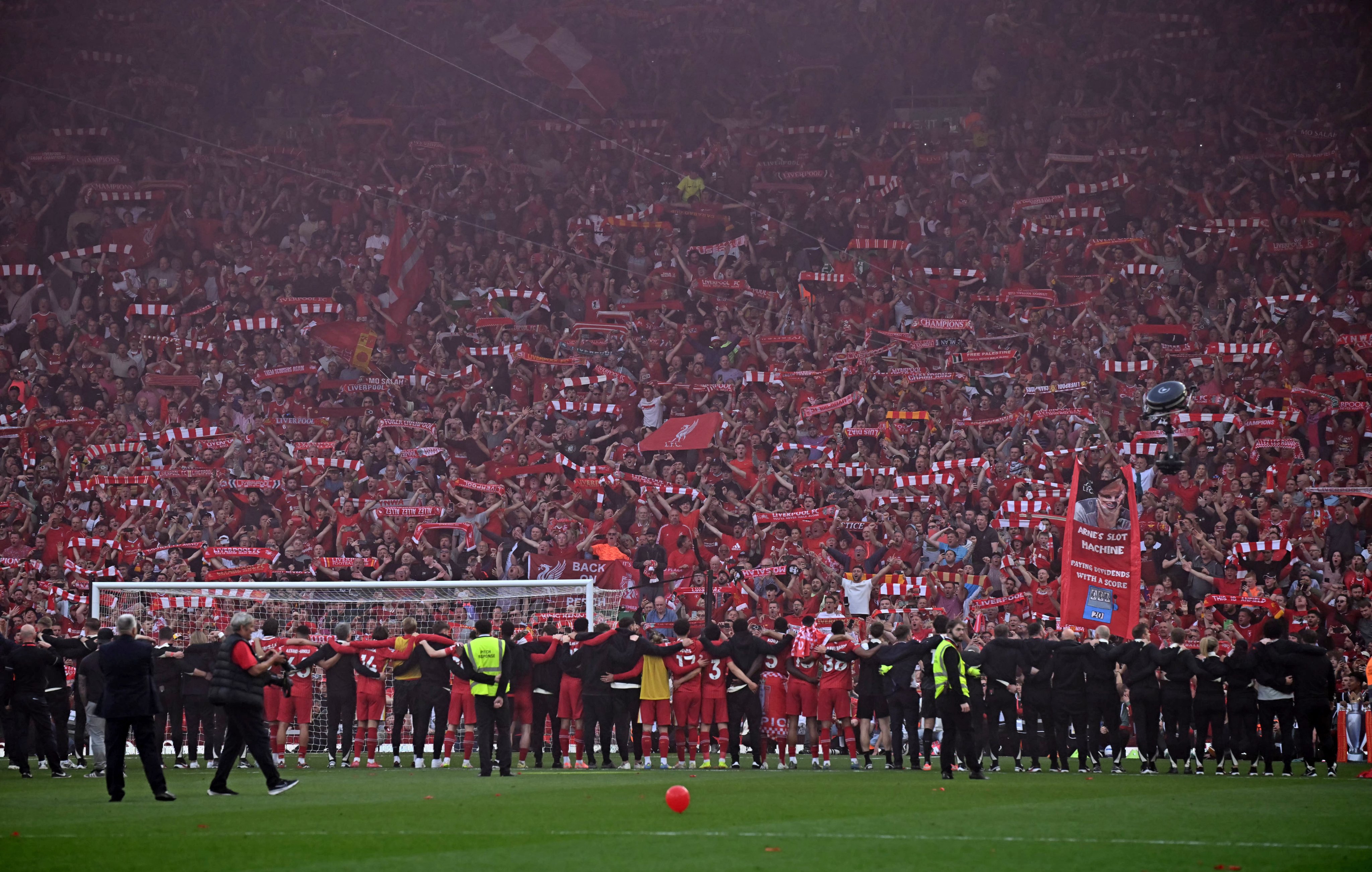 after winning the premier league, the team is singing their anthem "You'll Never Walk Alone" with the fans.